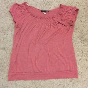 A cute pink shirt with ruffles